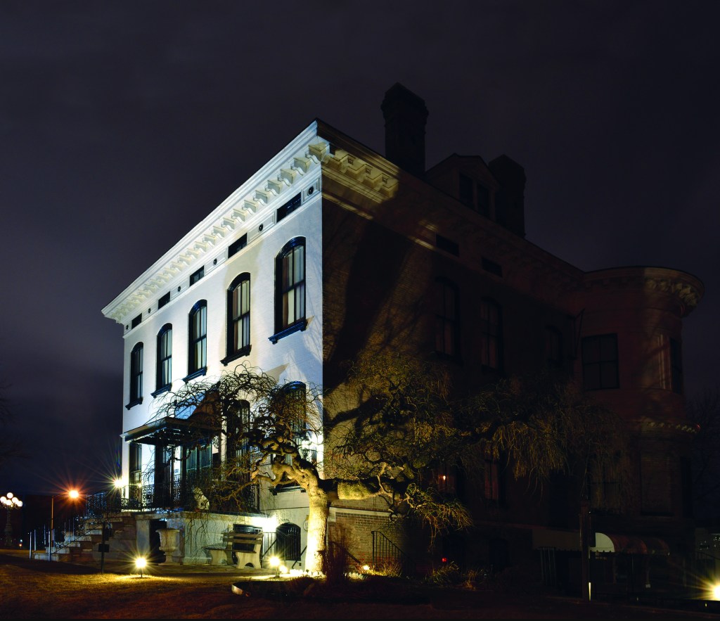 Photo of the Lemp Mansion at night.